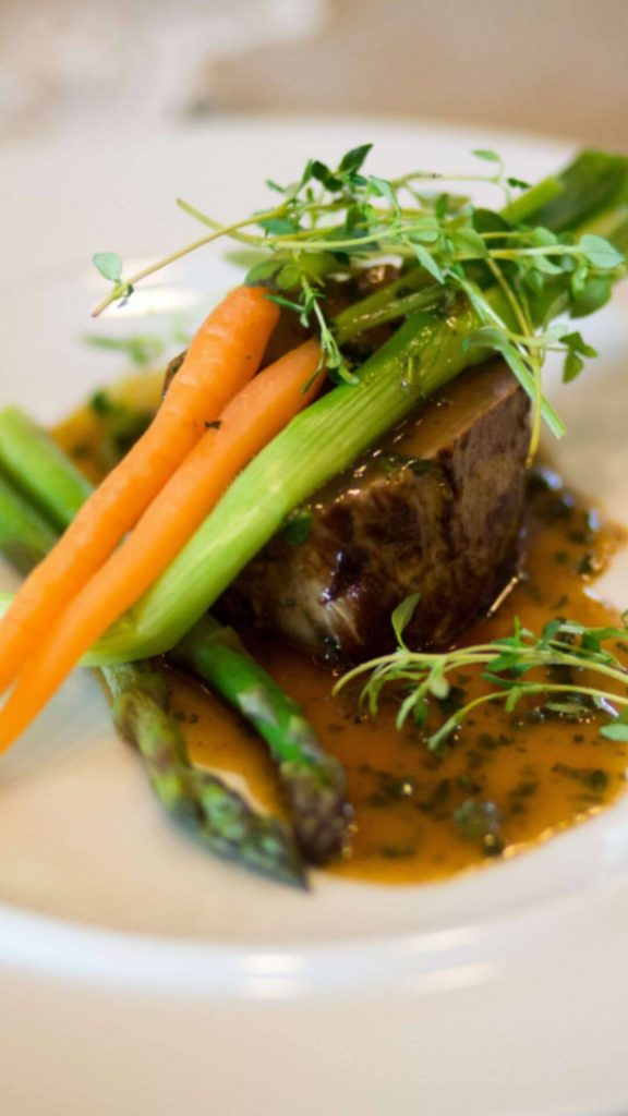 Demi glace with carrots as a beef consommé substitute.